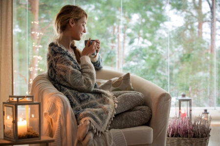 woman enjoying coffee in a chair